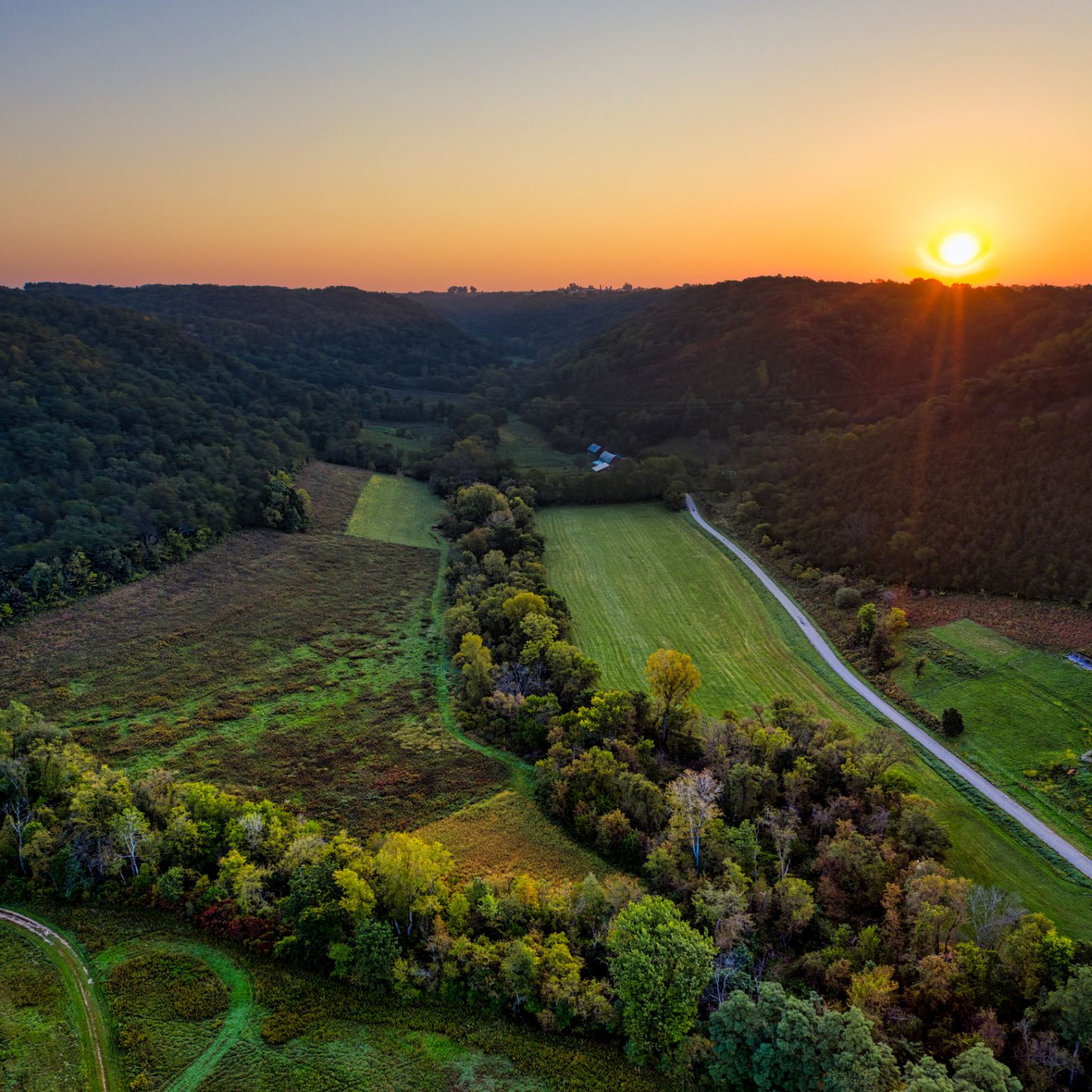 Rolling farmland at sunset